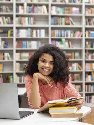 high-angle-teenage-girl-studying-library
